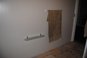 New  fittings on newly painted clay coloured wall, with new floor tiles